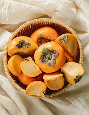 Persimmon Fruits in Basket